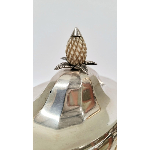 27 - A VERY GOOD QUALITY ART DECO PERIOD SILVER TEA POT, oval in shape with a raised pineapple finial to ... 