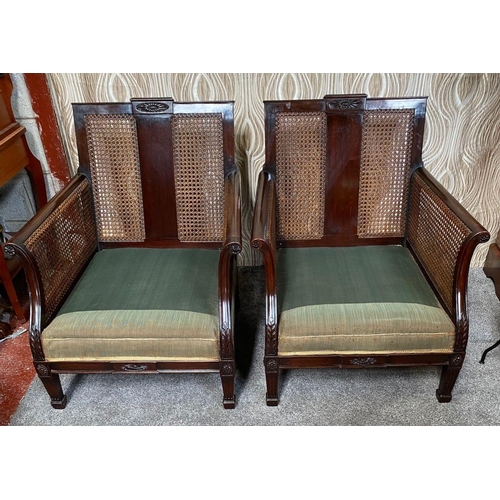 36 - A GREAT PAIR OF MAHOGANY FRAMED BERGÉRE ARMCHAIRS, with carved floral detail to the centre of the ba... 