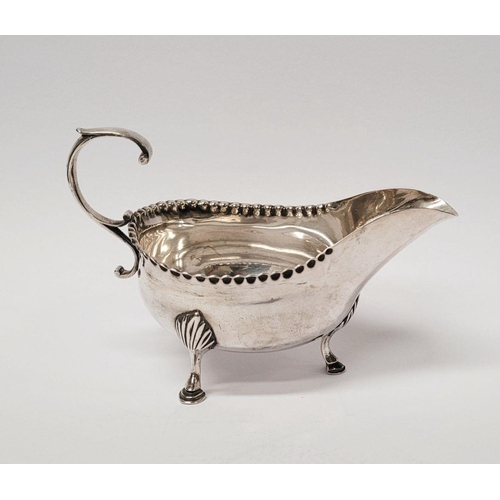 4 - A VERY FINELY CRAFTED GEORGIAN LATE 18TH CENTURY SOLID SILVER SAUCE BOAT BY JOHN LANGLANDS I, with a... 