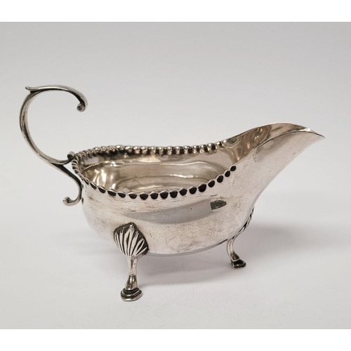 4 - A VERY FINELY CRAFTED GEORGIAN LATE 18TH CENTURY SOLID SILVER SAUCE BOAT BY JOHN LANGLANDS I, with a... 