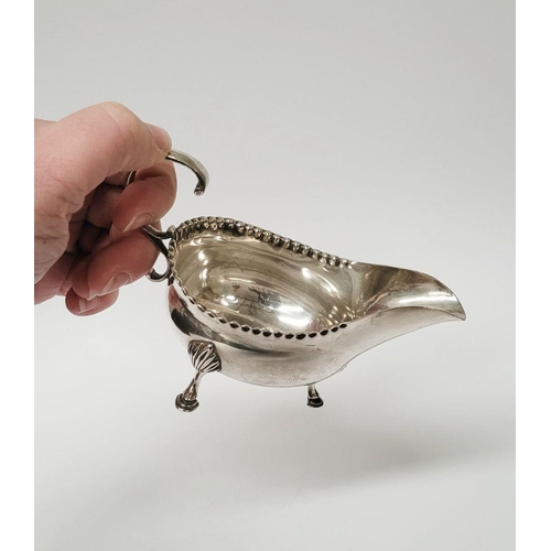 4 - A VERY FINELY CRAFTED GEORGIAN LATE 18TH CENTURY SOLID SILVER SAUCE BOAT BY JOHN LANGLANDS I, with a... 