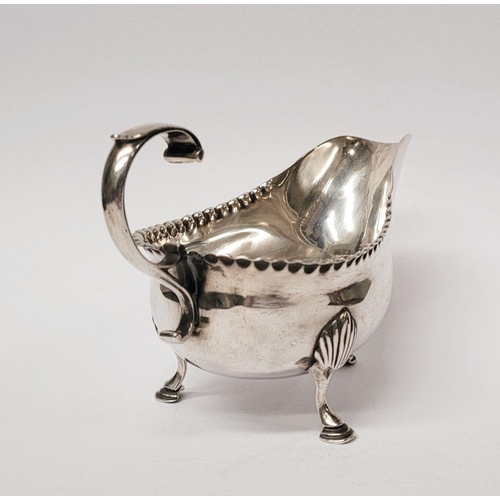 4 - A VERY FINELY CRAFTED GEORGIAN LATE 18TH CENTURY SOLID SILVER SAUCE BOAT BY JOHN LANGLANDS I, with a... 