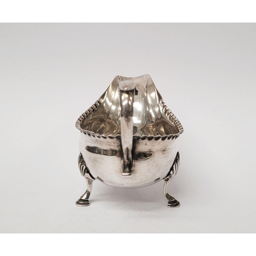 4 - A VERY FINELY CRAFTED GEORGIAN LATE 18TH CENTURY SOLID SILVER SAUCE BOAT BY JOHN LANGLANDS I, with a... 