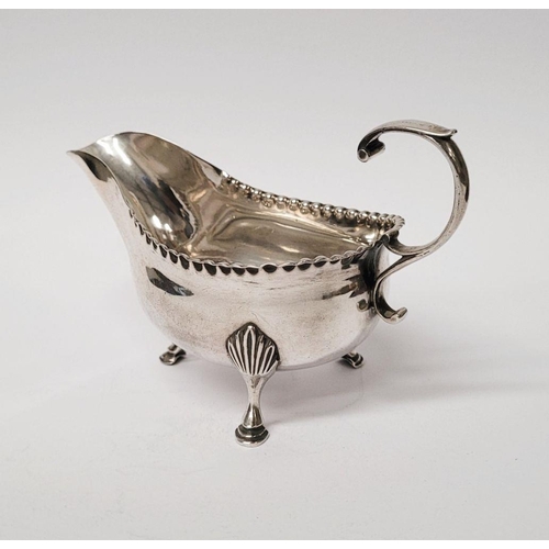 4 - A VERY FINELY CRAFTED GEORGIAN LATE 18TH CENTURY SOLID SILVER SAUCE BOAT BY JOHN LANGLANDS I, with a... 