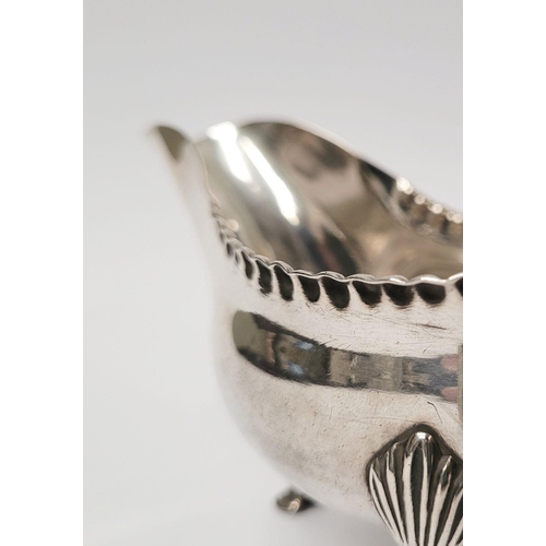 4 - A VERY FINELY CRAFTED GEORGIAN LATE 18TH CENTURY SOLID SILVER SAUCE BOAT BY JOHN LANGLANDS I, with a... 