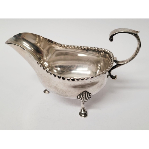 4 - A VERY FINELY CRAFTED GEORGIAN LATE 18TH CENTURY SOLID SILVER SAUCE BOAT BY JOHN LANGLANDS I, with a... 