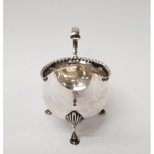 4 - A VERY FINELY CRAFTED GEORGIAN LATE 18TH CENTURY SOLID SILVER SAUCE BOAT BY JOHN LANGLANDS I, with a... 