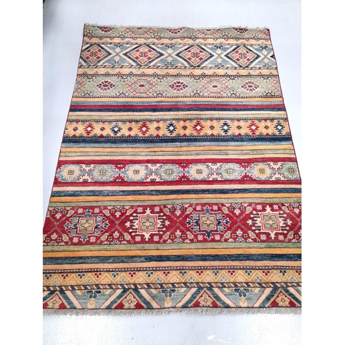 43 - AN EXCELLENT AFGHAN KAZAK RUG, hand woven, with multiple striped geometric panels in vibrant blue, r... 