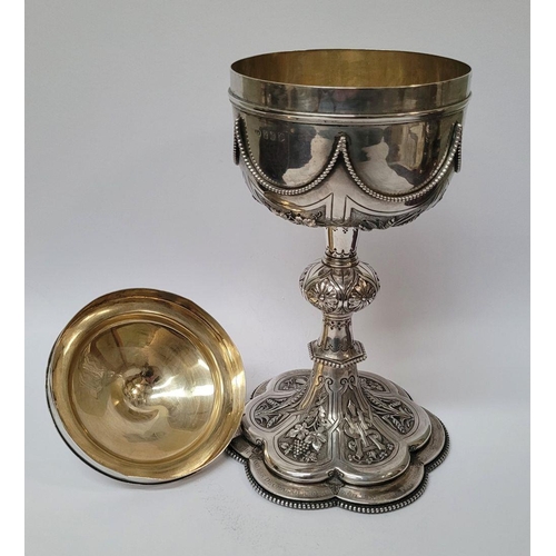 47 - A VERY DECORATIVE IRISH SILVER & GILT CIBORIUM, the lid with a cross finial, the bowl decorated with... 