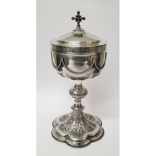 47 - A VERY DECORATIVE IRISH SILVER & GILT CIBORIUM, the lid with a cross finial, the bowl decorated with... 