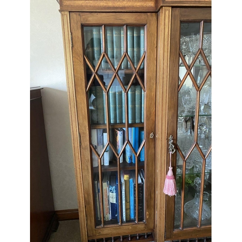 49 - A FINE ASTRAL GLAZED BREAKFRONT THREE DOOR DISPLAY CABINET, with three quarter gallery to top above ... 