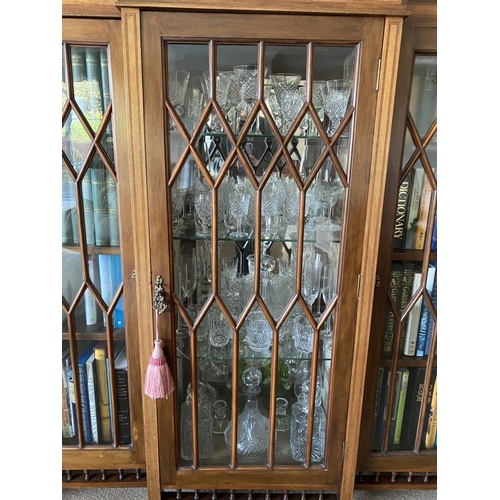 49 - A FINE ASTRAL GLAZED BREAKFRONT THREE DOOR DISPLAY CABINET, with three quarter gallery to top above ... 