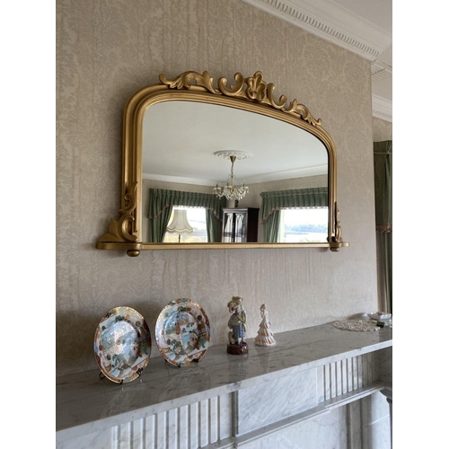 52 - A GOOD ARCHED GILT OVERMANTLE MIRROR, the fluted border with scroll crest to top and scrolls to base... 