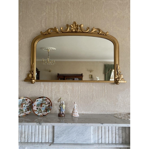 52 - A GOOD ARCHED GILT OVERMANTLE MIRROR, the fluted border with scroll crest to top and scrolls to base... 