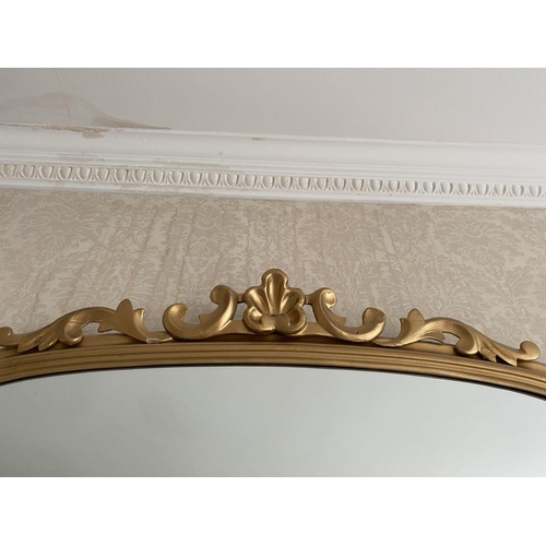 52 - A GOOD ARCHED GILT OVERMANTLE MIRROR, the fluted border with scroll crest to top and scrolls to base... 