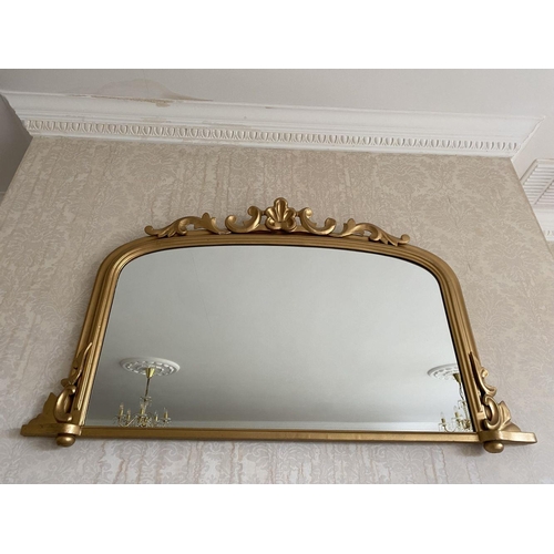 52 - A GOOD ARCHED GILT OVERMANTLE MIRROR, the fluted border with scroll crest to top and scrolls to base... 