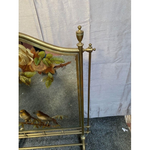 54 - A LATE 19TH / EARLY 20TH CENTURY BRASS FRAMED MIRRORED FIRE SCREEN, the mirror pane decorated with h... 