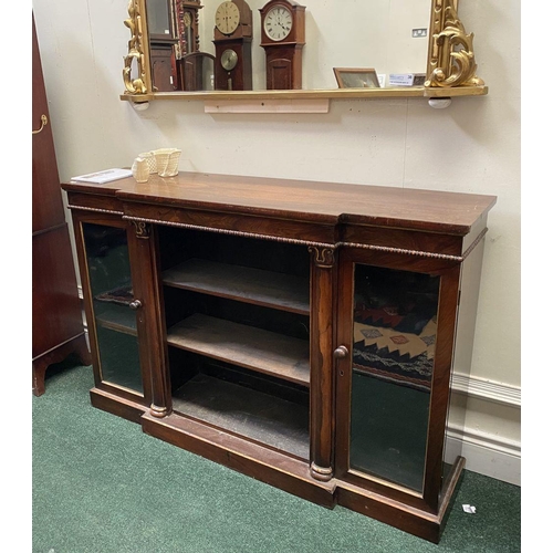 56 - A 19TH CENTURY IRISH ROSEWOOD BREAKFRONT FLOOR BOOKCASE, the top having square edge with molding abo... 