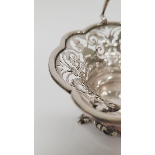 6 - A BEAUTIFUL EARLY 19TH CENTURY SOLID SILVER SCALLOP EDGED BASKET WITH SWING HANDLE, decorated with a... 