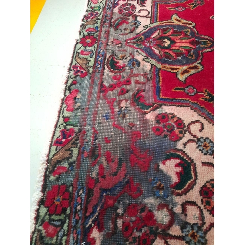 60 - A VIBRANT PERSIAN TABRIZ RUG, hand-knotted, featuring traditional Tabriz design with central medalli... 