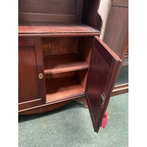 66 - A FINE GEORGE III MAHOGANY WATERFALL BOOKCASE CABINET, with three cascading open shelves, enclosed b... 