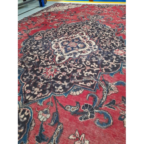 67 - AN EXCELLENT PERSIAN TABRIZ RUG, hand-knotted, featuring traditional Tabriz design with central meda... 