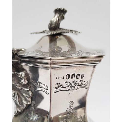 7 - A VERY FINE IRISH 19TH CENTURY SILVER HOT WATER/MILK POT / TEA POT, decorated all over with scrollin... 