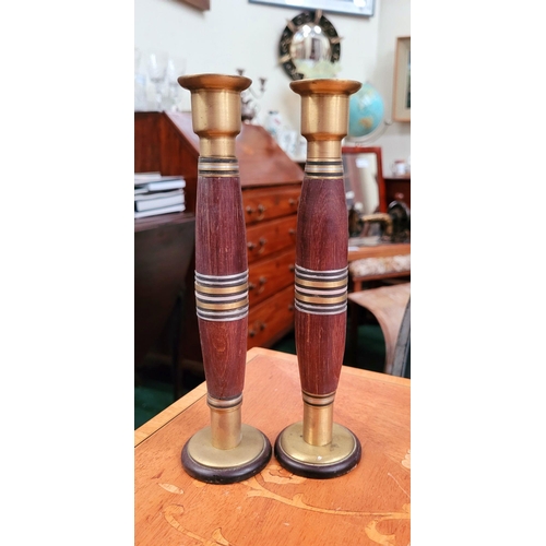 76 - A PAIR OF WOOD TURNED BRASS TOPPED CANDLE STICKS, each with brass top & bottom the centre with bands... 