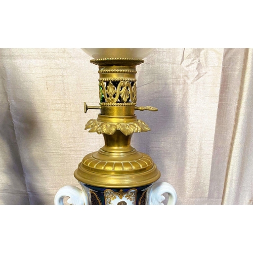 78 - A FANTASTIC PAIR OF VICTORIAN PORCELAIN & BRASS OIL LAMPS, complete with frosted globe shaped lamp s... 