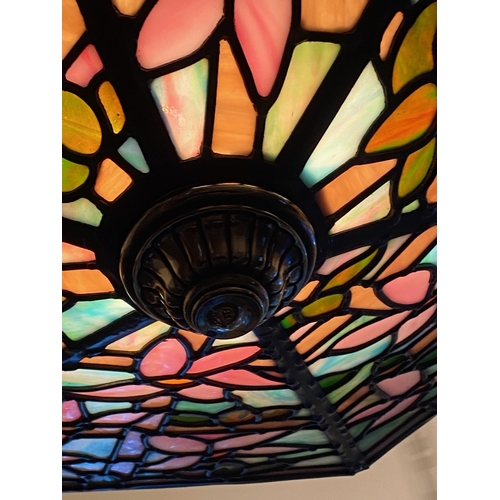 123 - A BEAUTIFUL ART DECO COLOURED GLASS LEADED LAMPSHADE, with six panels of multi-coloured glass in flo... 