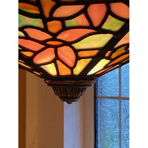 123 - A BEAUTIFUL ART DECO COLOURED GLASS LEADED LAMPSHADE, with six panels of multi-coloured glass in flo... 