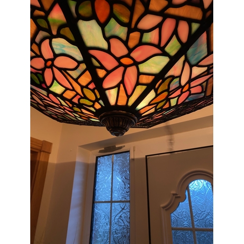 123 - A BEAUTIFUL ART DECO COLOURED GLASS LEADED LAMPSHADE, with six panels of multi-coloured glass in flo... 