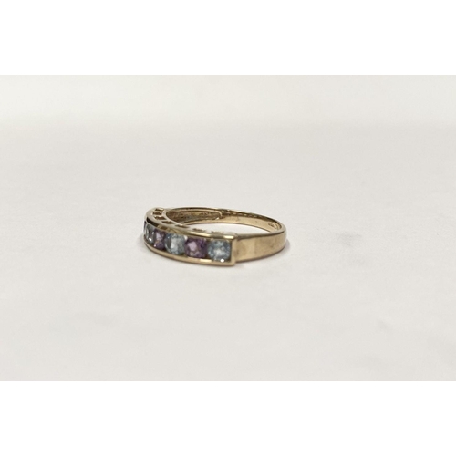 109 - A PRETTY 9CT GOLD BLUE AND PINK STONE HALF ETERNITY RING, with seven round cut pink and pale blue ge... 