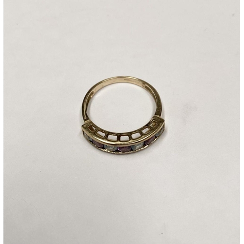 109 - A PRETTY 9CT GOLD BLUE AND PINK STONE HALF ETERNITY RING, with seven round cut pink and pale blue ge... 