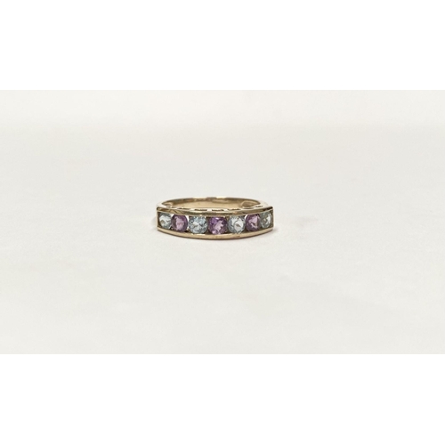 109 - A PRETTY 9CT GOLD BLUE AND PINK STONE HALF ETERNITY RING, with seven round cut pink and pale blue ge... 