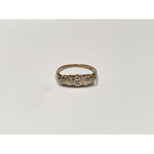 113 - A DELICATE 9CT THREE STONE DIAMOND RING, with three round cut diamonds in illusion gypsy setting, wi... 