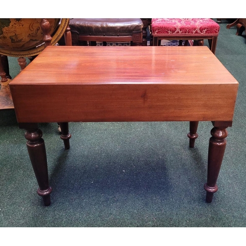 122 - A LOW RISE COFFEE / LAMP TABLE, the top rests upon a mahogany frame with four tapered turned legs. P... 