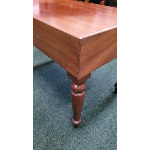 122 - A LOW RISE COFFEE / LAMP TABLE, the top rests upon a mahogany frame with four tapered turned legs. P... 