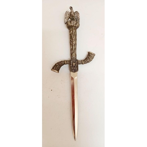 129 - A DECORATIVE LETTER OPENER/PAPER KNIFE, the handle topped with an eagle, 26cm long.