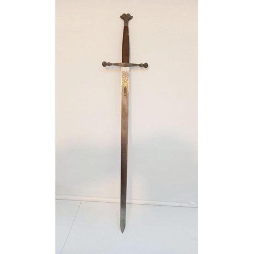 132 - A SPANISH CARLOS V COMMEMORATIVE TOLEDO MADE SWORD, with engraved blade. Dimensions: 107cm long over... 