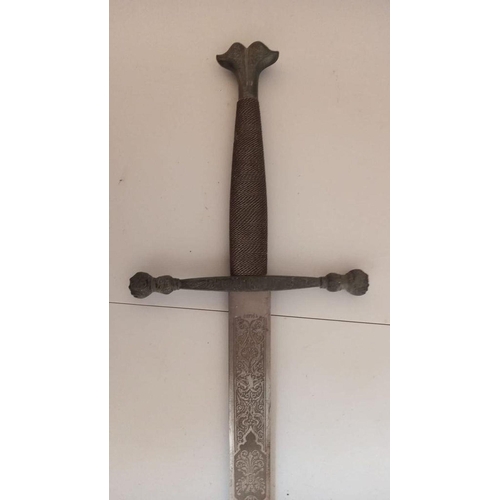 132 - A SPANISH CARLOS V COMMEMORATIVE TOLEDO MADE SWORD, with engraved blade. Dimensions: 107cm long over... 