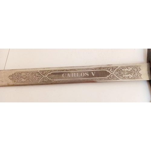 132 - A SPANISH CARLOS V COMMEMORATIVE TOLEDO MADE SWORD, with engraved blade. Dimensions: 107cm long over... 