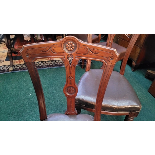 138 - A LOVELY SET OF FOUR VICTORIAN DINING CHAIRS, each with carved back rests with a central back splat ... 