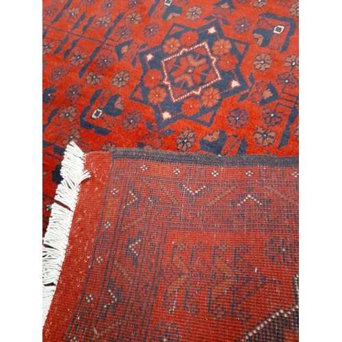 141 - AN AUTHENTIC AFGHAN KHAN MOHAMMADI RUG, hand-woven in the traditional Khan Mohammadi pattern in vibr... 