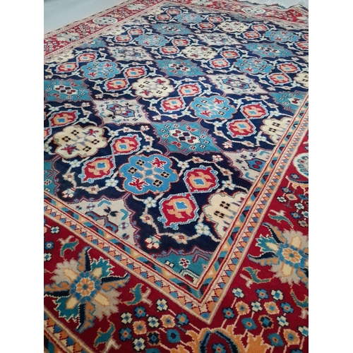 143 - A FINE AFGHAN KAZAK RUG, hand-woven, with central repeat geometric pattern surrounded by multiple bo... 