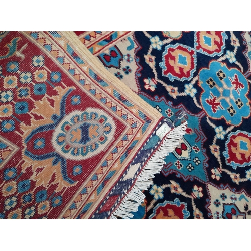 143 - A FINE AFGHAN KAZAK RUG, hand-woven, with central repeat geometric pattern surrounded by multiple bo... 