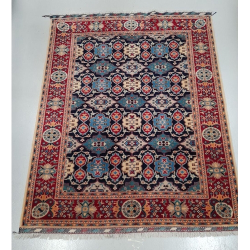 143 - A FINE AFGHAN KAZAK RUG, hand-woven, with central repeat geometric pattern surrounded by multiple bo... 