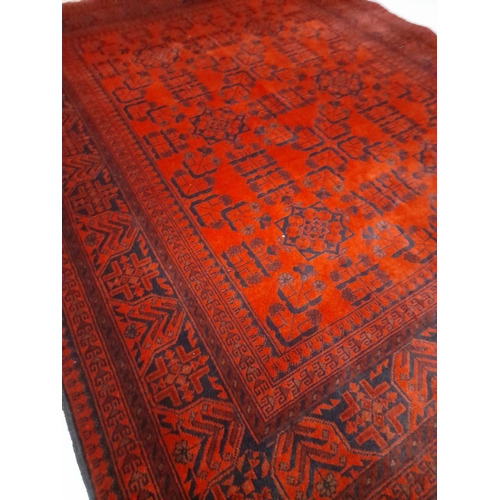 147 - AN AUTHENTIC AFGHAN KHAN MOHAMMADI RUG, hand-woven in the traditional Khan Mohammadi pattern in vibr... 