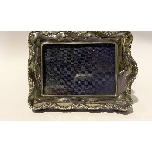 150 - A DECORATIVE MINIATURE SILVER PHOTO FRAME, Maker John Bull Ltd New Bond Street, London W1, c.1988. W... 