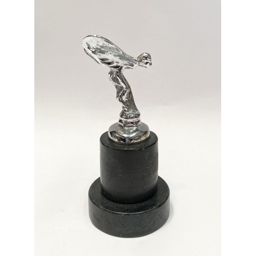 154 - A ROLLS ROYCE SPIRIT OF ECSTACY PAPERWEIGHT, on heavy circular platform base. Dimensions: 12.5cm hig... 